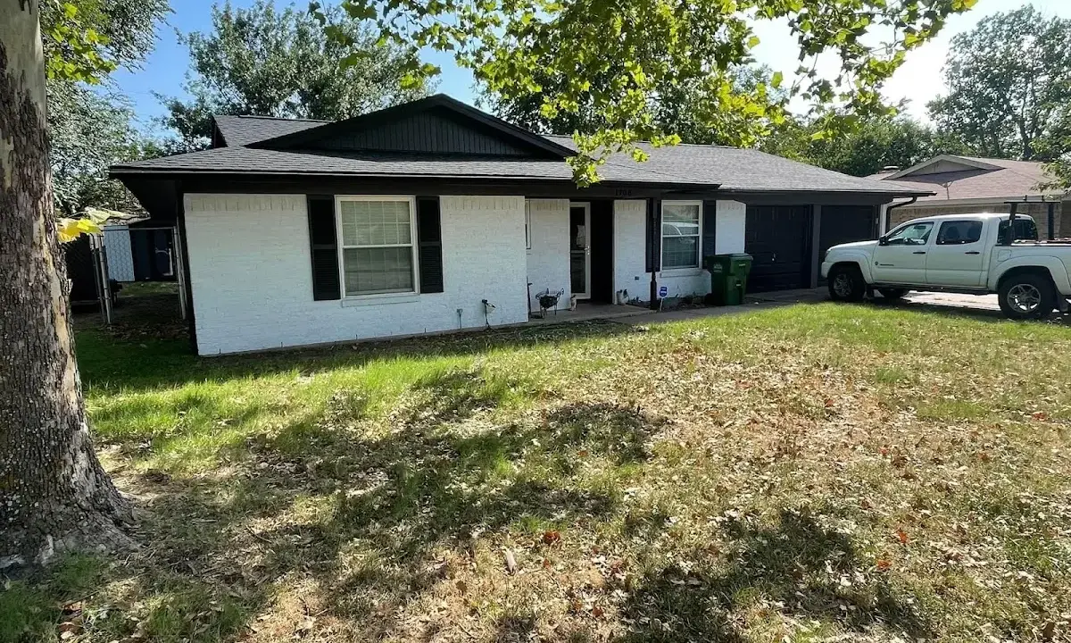 Professional roofing crew working on a residential roof in North Hills